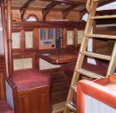 All interior surfaces and furniture comprise a variety of hardwoods